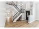 Grand entryway with wood floors, a staircase, and views into multiple living spaces at 13383 N 101St Way, Scottsdale, AZ 85260