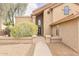 Inviting entryway featuring a stone walkway and a large arched window above the front door at 13383 N 101St Way, Scottsdale, AZ 85260