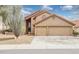 Charming two-story home featuring a three-car garage and drought-tolerant landscaping at 13383 N 101St Way, Scottsdale, AZ 85260