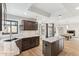 Open kitchen featuring granite countertops, stainless appliances, and wood cabinets and flooring at 13383 N 101St Way, Scottsdale, AZ 85260