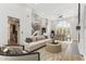 Bright living room features wood floors and access to the dining room and kitchen at 13383 N 101St Way, Scottsdale, AZ 85260