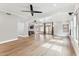 Bright open living room with access to kitchen, dining, and a wall of windows at 13383 N 101St Way, Scottsdale, AZ 85260