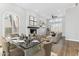 A bright living room is furnished with dining table and living room furniture at 13383 N 101St Way, Scottsdale, AZ 85260