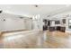 Open-concept living room with wood floors, recessed lighting, and ceiling fan at 13383 N 101St Way, Scottsdale, AZ 85260