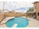 Backyard pool with diving board, patio, and privacy wall at 13383 N 101St Way, Scottsdale, AZ 85260