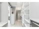 Spacious walk-in closet with custom shelving and ample storage space at 13383 N 101St Way, Scottsdale, AZ 85260