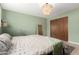Serene bedroom with modern light fixture, closet, and boho decor at 1340 E Golden Ln, Phoenix, AZ 85020
