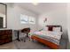 Modern bedroom featuring desk, chair, closet and patterned bedding at 1340 E Golden Ln, Phoenix, AZ 85020