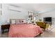 Cozy bedroom with soft pink comforter, white bookshelf, and modern decor at 1340 E Golden Ln, Phoenix, AZ 85020