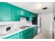 Bright kitchen with green cabinets, stainless steel appliances, and ample counter space at 1340 E Golden Ln, Phoenix, AZ 85020