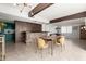 Open-concept space with living, dining, and kitchen featuring stylish lighting, and wood accents at 1340 E Golden Ln, Phoenix, AZ 85020