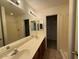 Clean bathroom with dual sinks, large mirror, and tiled shower and tub combo at 15655 N 29Th St, Phoenix, AZ 85032