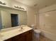 Bathroom featuring a double sink vanity with shower and tub at 15655 N 29Th St, Phoenix, AZ 85032