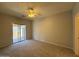 Relaxing bedroom featuring plush carpeting and sliding glass doors at 15655 N 29Th St, Phoenix, AZ 85032
