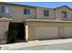 Inviting two-story townhouse with attached garage and neutral stucco exterior at 15655 N 29Th St, Phoenix, AZ 85032