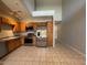 Modern kitchen with stainless steel appliances, wooden cabinets, and ample counter space at 15655 N 29Th St, Phoenix, AZ 85032