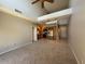 Open-concept living room with vaulted ceilings, modern lighting, and kitchen view at 15655 N 29Th St, Phoenix, AZ 85032