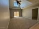 Spacious living room with vaulted ceiling and large sliding glass doors to patio at 15655 N 29Th St, Phoenix, AZ 85032