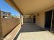 Covered patio features a privacy wall, and sliding glass door access to the home's interior at 15655 N 29Th St, Phoenix, AZ 85032