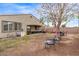 Large backyard space featuring a covered patio, lawn area and patio furniture at 16268 W Cortez St, Surprise, AZ 85379