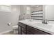 Updated bathroom with a large vanity, new fixtures, and a shower-tub combo at 16268 W Cortez St, Surprise, AZ 85379