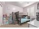 Neutral-toned bedroom features a light gray bunk bed and carpet flooring at 16268 W Cortez St, Surprise, AZ 85379