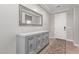 Elegant entryway with decorative cabinet, large mirror and tile flooring at 16268 W Cortez St, Surprise, AZ 85379