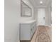 Elegant entryway with decorative cabinet, large mirror and tile flooring at 16268 W Cortez St, Surprise, AZ 85379