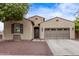 Charming single-story home with desert landscaping, private entry, and a two car garage at 16268 W Cortez St, Surprise, AZ 85379