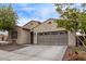 Charming single-story home with desert landscaping, private entry, and a two car garage at 16268 W Cortez St, Surprise, AZ 85379