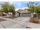 Charming single-story home with desert landscaping, private entry, and a two car garage at 16268 W Cortez St, Surprise, AZ 85379