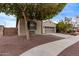 Single story home with desert landscaping, and a two-car garage at 16268 W Cortez St, Surprise, AZ 85379