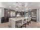 Modern kitchen with a large marble island, stainless steel appliances, and pendant lighting at 16268 W Cortez St, Surprise, AZ 85379