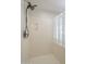 Bathroom shower with glass block window and adjustable shower head at 16462 W Rowel Rd, Surprise, AZ 85387