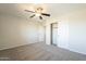 Bedroom features gray carpet, closet and neutral walls at 16462 W Rowel Rd, Surprise, AZ 85387
