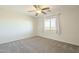 Comfortable bedroom with a ceiling fan and neutral walls at 16462 W Rowel Rd, Surprise, AZ 85387