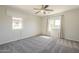 Spacious bedroom with ceiling fan and two windows at 16462 W Rowel Rd, Surprise, AZ 85387
