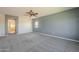 Expansive main bedroom with neutral-toned carpet and light gray walls at 16462 W Rowel Rd, Surprise, AZ 85387