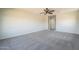 Spacious main bedroom with carpeted floors and a neutral color palette at 16462 W Rowel Rd, Surprise, AZ 85387