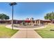 Community playground featuring colorful slides, climbing structures, and shaded picnic areas for neighborhood fun at 16462 W Rowel Rd, Surprise, AZ 85387