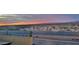 Stunning sunset view over the desert landscape from a backyard patio at 16462 W Rowel Rd, Surprise, AZ 85387