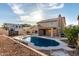 Home featuring a beautiful backyard with an inground pebble tec pool, desert landscaping, and a covered patio at 1701 E Yukon Dr, Phoenix, AZ 85024