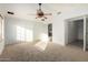 Primary bedroom featuring a ceiling fan and an ensuite bathroom at 1701 E Yukon Dr, Phoenix, AZ 85024