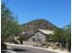 A lovely suburban home with desert landscaping in front of a mountain backdrop at 1701 E Yukon Dr, Phoenix, AZ 85024