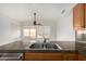 Kitchen features stainless steel sink, granite countertops, and a view at 1701 E Yukon Dr, Phoenix, AZ 85024