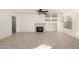 The bright living room has neutral tile flooring, a cozy fireplace, and recessed shelving at 1701 E Yukon Dr, Phoenix, AZ 85024
