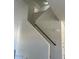 A view of the staircase with a modern handrail and neutral paint at 1701 E Yukon Dr, Phoenix, AZ 85024