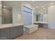 Elegant bathroom with a soaking tub and dual vanities at 17756 E Colt Dr, Queen Creek, AZ 85142