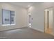 Bright bedroom boasts neutral tones and features a large window with natural light at 17756 E Colt Dr, Queen Creek, AZ 85142