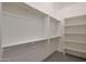 Walk-in closet showcasing ample shelving and rod space at 17756 E Colt Dr, Queen Creek, AZ 85142